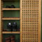 Shoe storage cabinet with sliding doors open with shoes